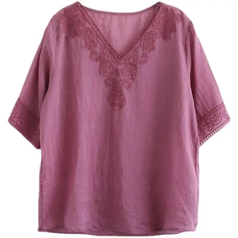 A soft mauve embroidered pink fashion retro cotton linen blouse with detailed embroidery on v-neckline and sleeve cuffs