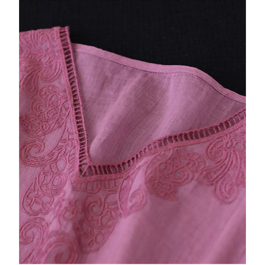 A delicate embroidered pink fashion retro cotton linen blouse with intricate floral lace detailing along the neckline