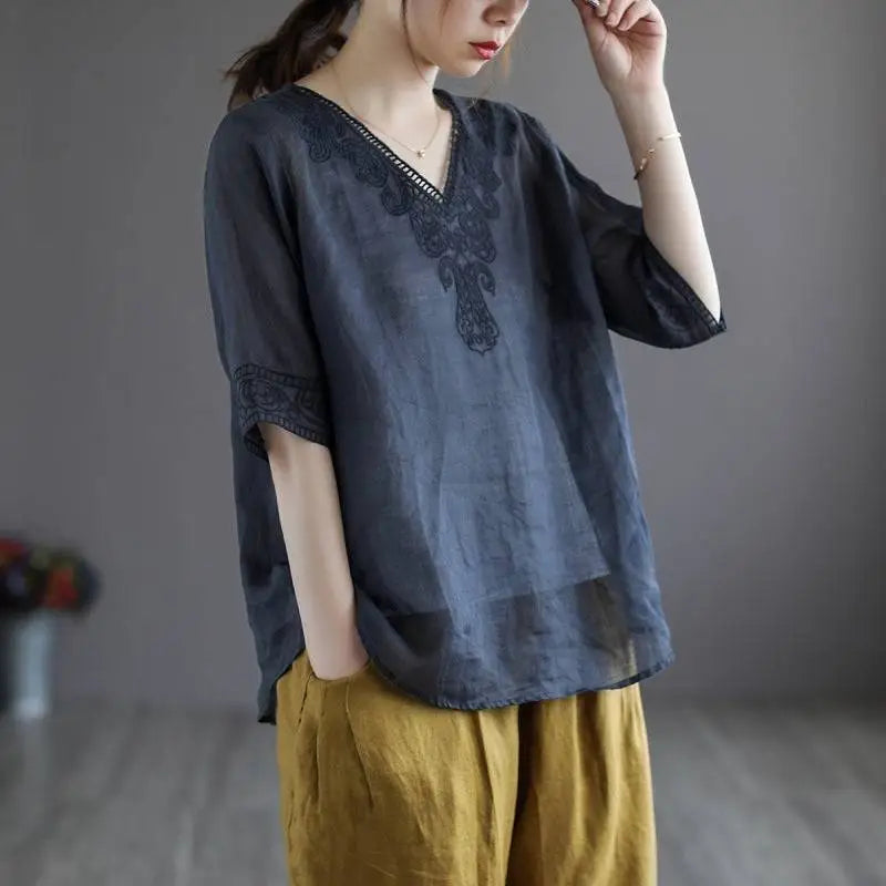 Dark blue cotton linen blouse with intricate black embroidery on v-neckline and sleeve cuffs fashion retro cotton style