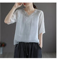 White embroidered cotton linen blouse with delicate lace detailing v-neck and sleeves fashion retro cotton style