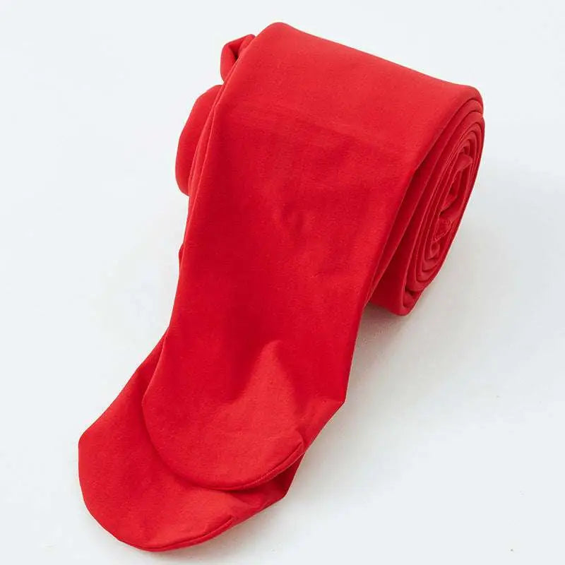 A pair of vibrant red stepping pants made of nylon single layer neatly rolled alongside embroidered red cardigan