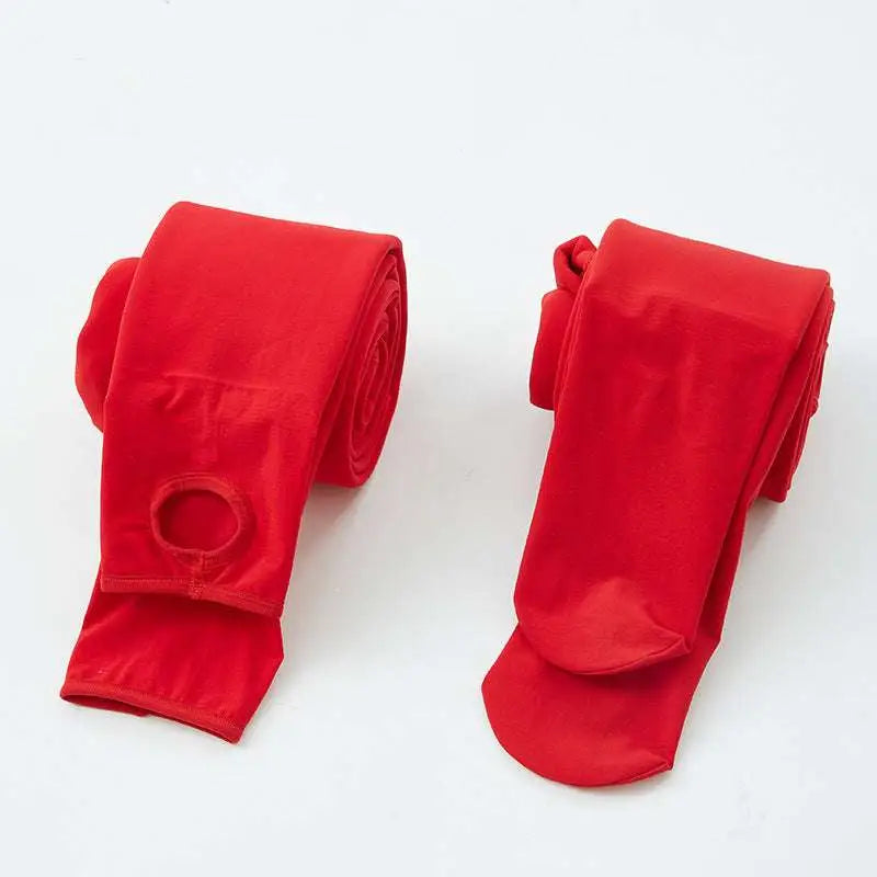 A pair of vibrant red stepping pants made of smooth nylon single layer with a circular opening for easy wear