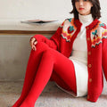 Embroidered red cardigan with strawberry and cherry details paired with red stepping pants in nylon single layer material
