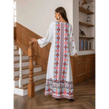 White embroidered rhinestone bead long sleeve maxi dress with intricate red blue and gold floral print on back and hem