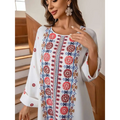 White embroidered rhinestone bead long sleeve maxi dress with vibrant red blue and gold floral print patterns