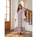 White embroidered rhinestone bead long sleeve maxi dress with intricate red blue and gold floral print patterns