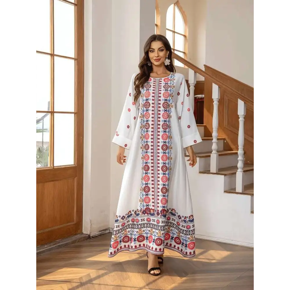 White embroidered rhinestone bead long sleeve maxi dress with intricate red blue and gold floral print patterns