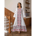 White embroidered rhinestone bead sleeve maxi dress with intricate red blue and gold circular floral print patterns