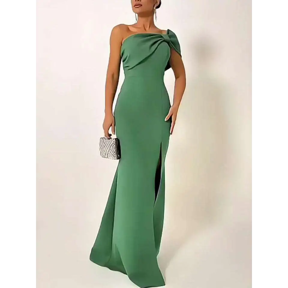 A sleek emerald green bow tube one shoulder evening gown with draped bow and high side slit for formal occasions