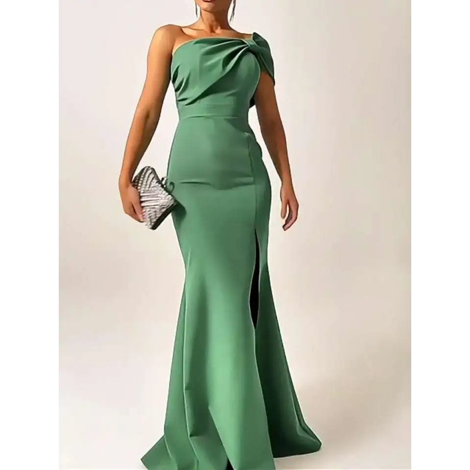A sleek emerald green bow satin mermaid shoulder evening gown with a draped bow accent for formal occasions