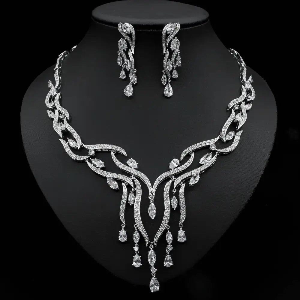 Elegant emerald green crystal zircon jewelry set with silver leaf-inspired necklace and cascading teardrop earrings