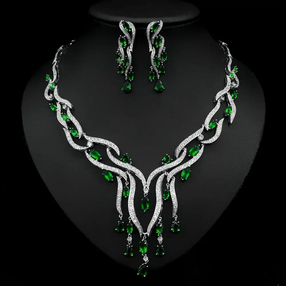 Elegant emerald green crystal zircon jewelry set with silver leaf-inspired necklace and cascading teardrop earrings
