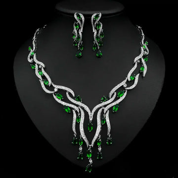 Elegant emerald green crystal zircon jewelry set with silver leaf-inspired necklace and cascading teardrop earrings