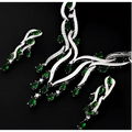 Emerald green crystal zircon jewelry set featuring teardrop gemstones in a flowing silver-toned intricate design
