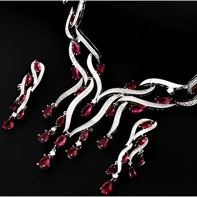 A sparkling silver zircon jewelry set featuring a necklace and earrings with vibrant red gemstones in an elegant design