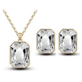 Emerald green crystal necklace set featuring a gold-tone chain with a rectangular clear crystal necklace pendant