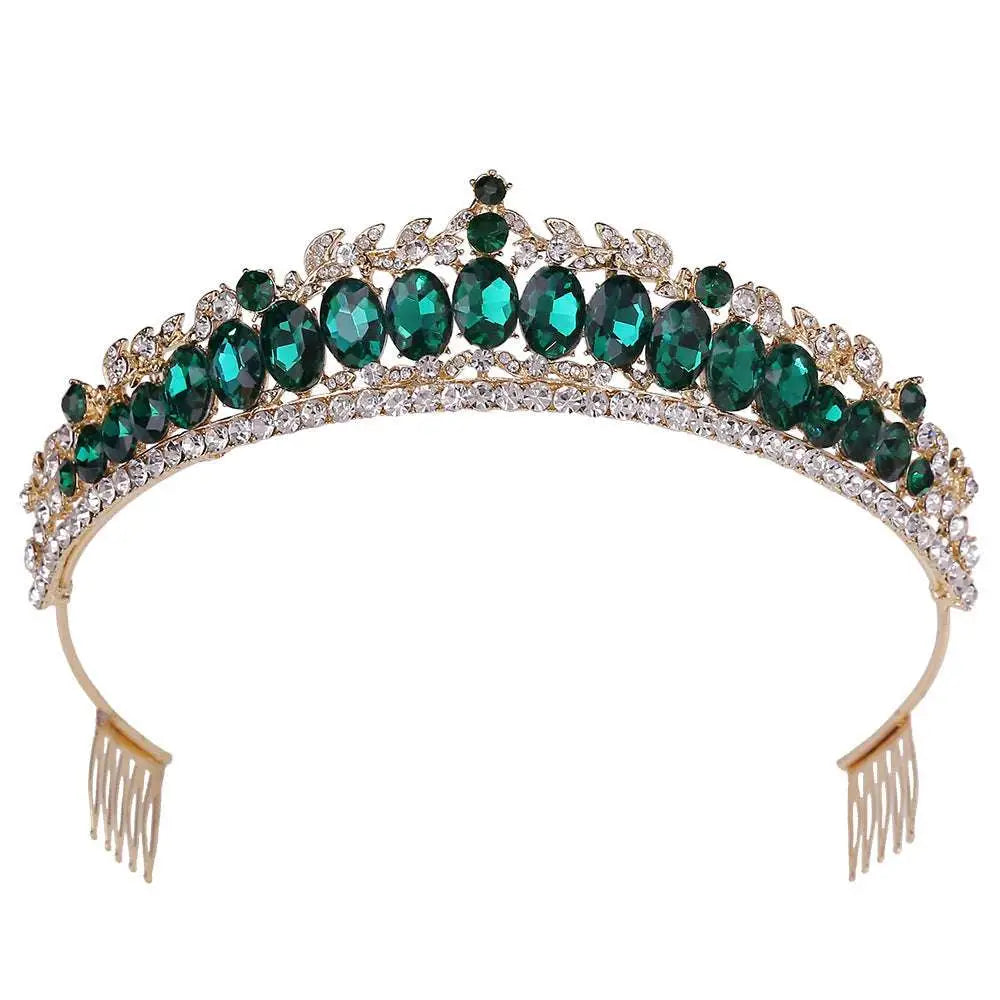 A sparkling gold fashion bridal knot tiara featuring emerald green oval crystals and decorative leaf motifs