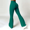 Emerald green high waist yoga pants with american hip raise design in smooth stretchy fabric and front twist detail