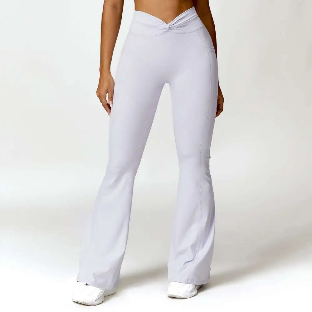 White high-waisted flared leggings with twisted waistband detail inspired by emerald green waist yoga pants and american hip raise