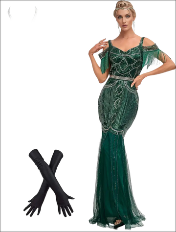 Emerald green luxury women’s fashion flapper dress with beaded fringe and silver embellishments paired with pearl necklace