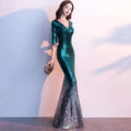 Emerald green polyester fiber sequined annual meeting gown with v-neckline and three-quarter sleeves mermaid design