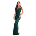 Emerald green sequined high waist mermaid gown with intricate lace and sequin detailing for evening wear