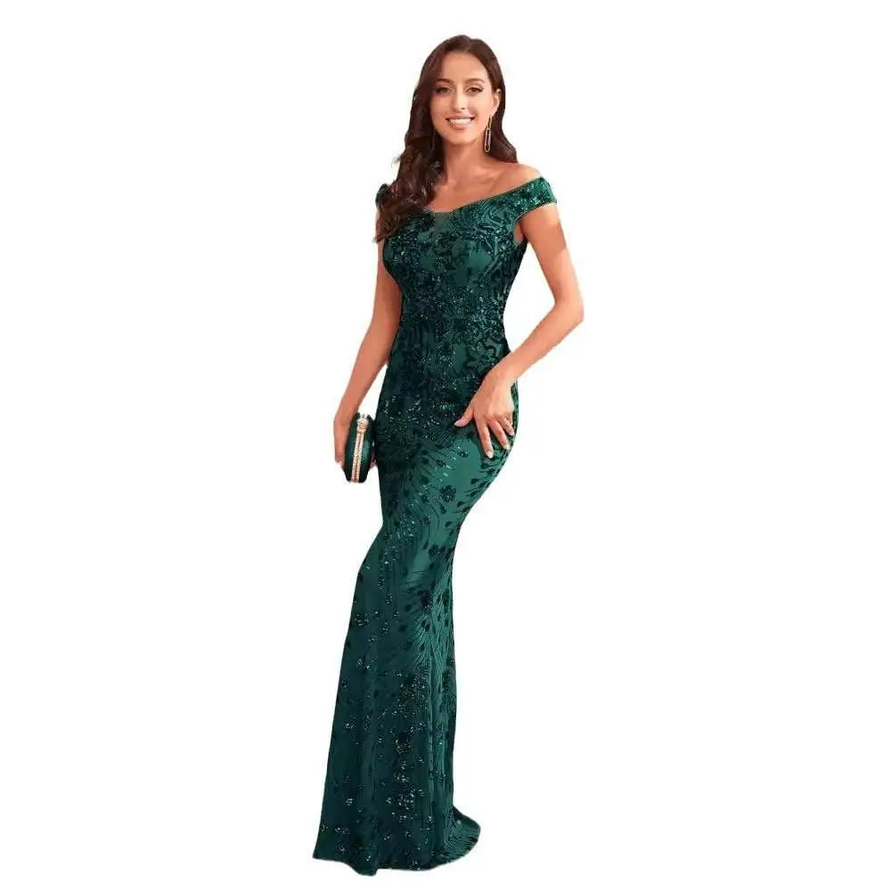 Emerald green sequined high waist mermaid gown with intricate lace and sequin detailing for evening wear