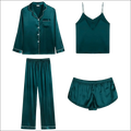Emerald green silk sleepwear long sleeve pajama set with white piping details in satin fabric