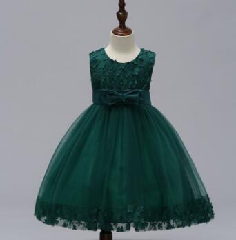 Emerald green sleeveless lace wedding dress with matching bow at the waist and tulle skirt ideal for a flower girl in the bridal party