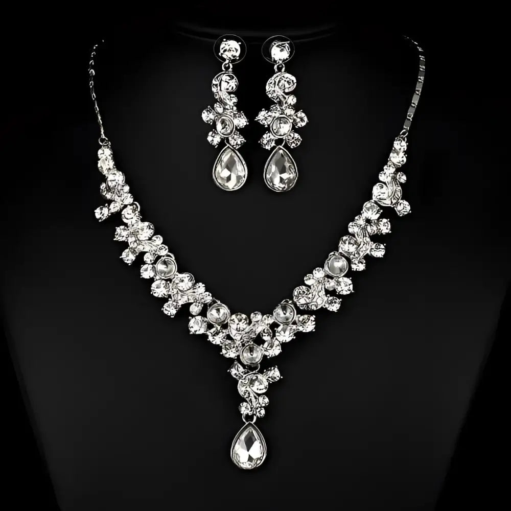 A sparkling silver wedding bride necklace and earrings set with clear crystal floral design for western wedding photography
