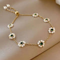 Delicate gold pearl flowers bracelet with five emerald green gemstones and white pearls on fashion adjustable chain