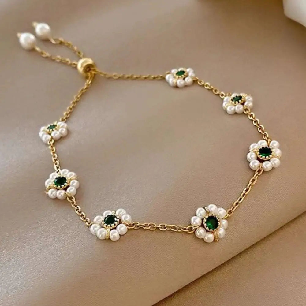 Delicate gold pearl flowers bracelet with five emerald green gemstones and white pearls on fashion adjustable chain
