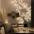 Enchanting vine lights warm led tree branch decor featuring a delicate dark-toned tree with warm white fairy lights creating a tranquil oasis