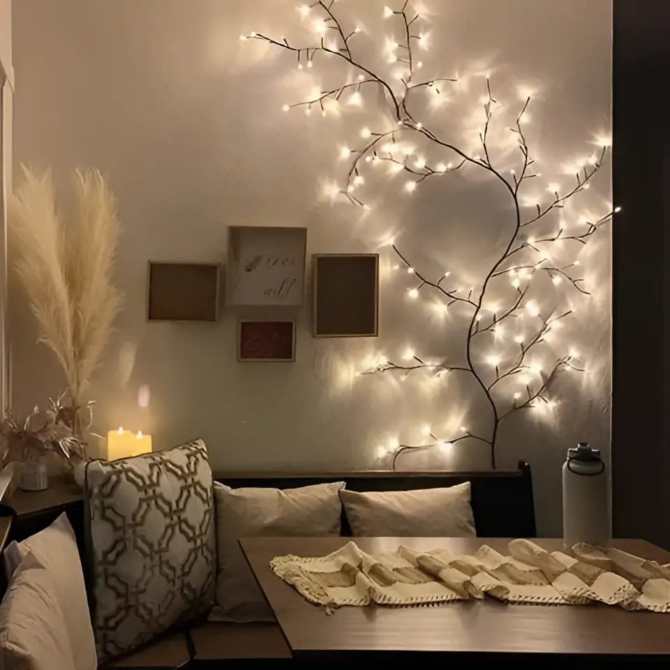 A delicate dark-toned decorative tree with enchanting vine lights featuring warm yellow led branches creating a tranquil oasis