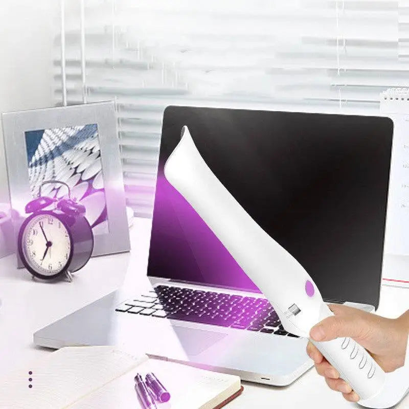White handheld travel sterilization lamp stick with purple accent button and textured grip for ergonomic use