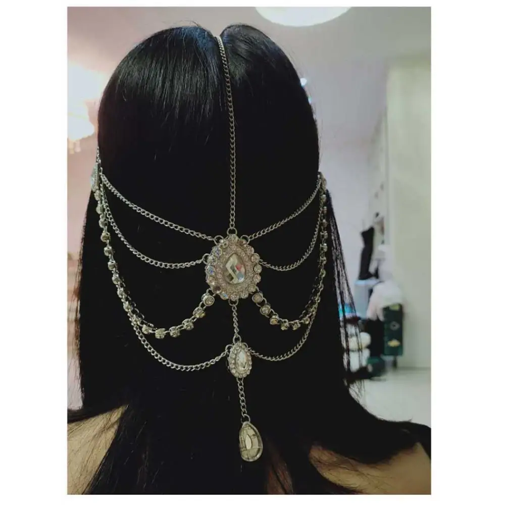 Silver chain ethnic purple crystal style headwear with dangling crystal pendants and a central ornate oval centerpiece