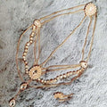 Gold-toned ethnic purple crystal style headwear hair accessory with multi-strand rhinestones and ornate circular embellishments