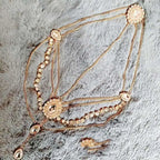 Gold-toned ethnic purple crystal style headwear hair accessory with multi-strand rhinestones and ornate circular embellishments
