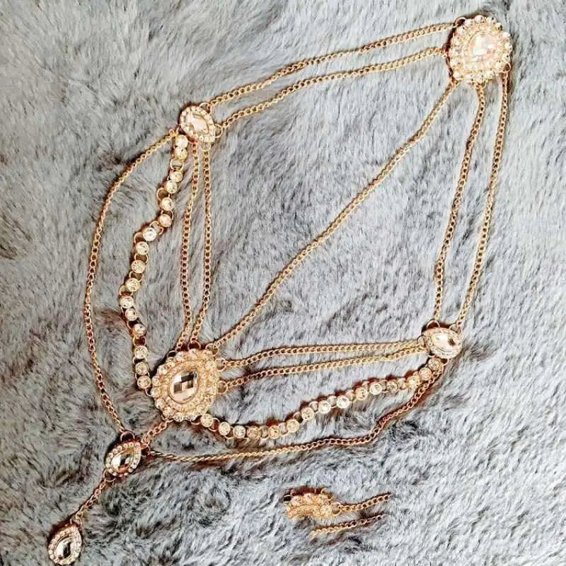 Gold-toned ethnic purple crystal style headwear hair accessory with multi-strand rhinestones and ornate circular embellishments