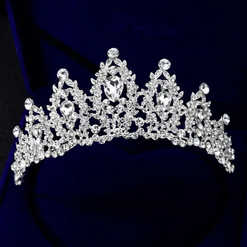 A sparkling silver bridal crown european adorned with clear teardrop crystals and an intricate leaf design