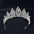 Silver bridal crown european featuring intricate lace-like metalwork and sparkling teardrop crystals for weddings