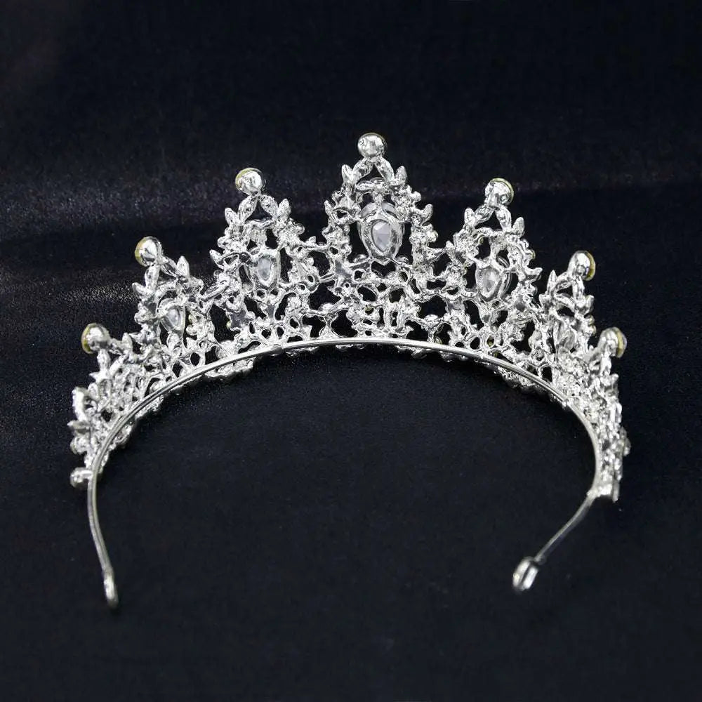 Silver bridal crown european featuring intricate lace-like metalwork and sparkling teardrop crystals for weddings