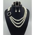 Elegant european fashion diamond gemstone pearl jewelry set featuring a three-strand pearl necklace with onyx accents and matching earrings and bracelet