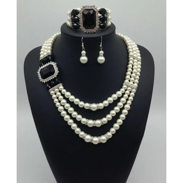 Elegant european fashion diamond gemstone pearl jewelry set featuring a three-strand pearl necklace with onyx accents and matching earrings and bracelet
