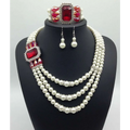Elegant european fashion diamond gemstone pearl jewelry set featuring three-strand pearl necklace with red accents and matching earrings and bracelet