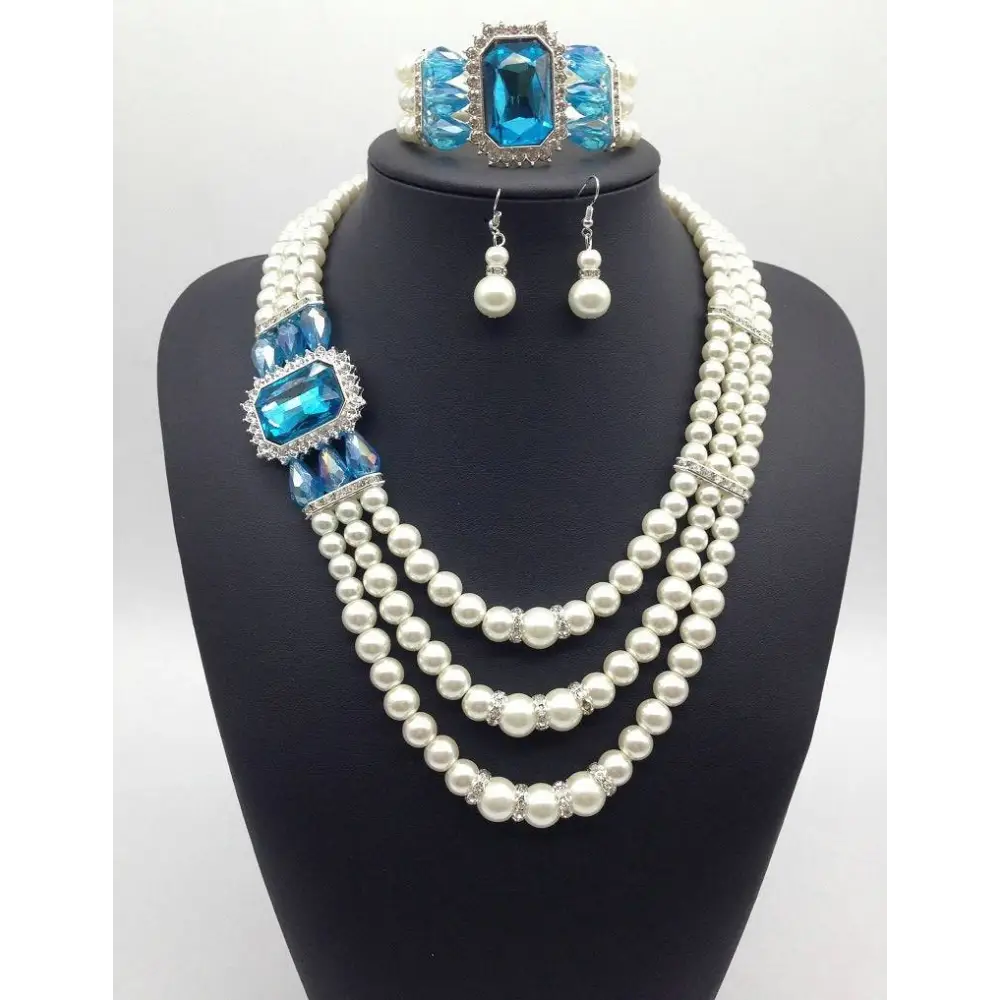 Elegant european fashion diamond gemstone pearl jewelry set with three-strand pearl necklace and matching blue gemstone accents