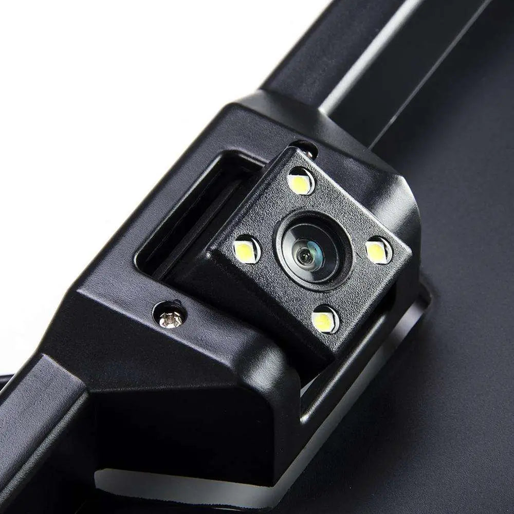 Black plastic european license plate with integrated night vision camera module shown from the back side