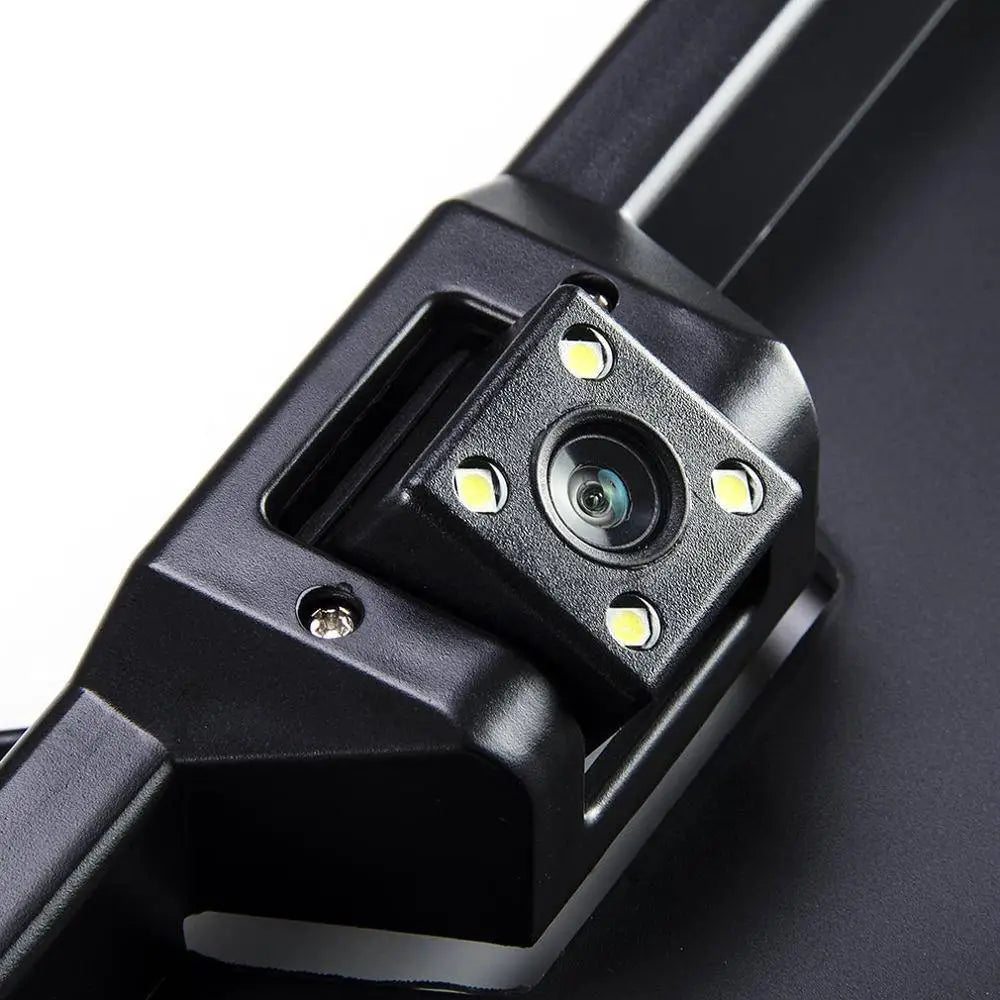 Black plastic European license plate night vision camera with four integrated LED lights showing the back side