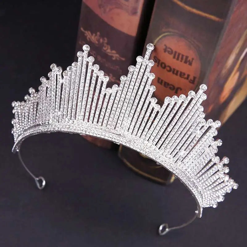 A sparkling silver European style birthday headdress crown adorned with clear crystals in a regal pointed design