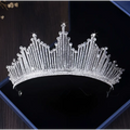 A sparkling silver European style birthday headdress crown adorned with clear crystals in a regal pointed design